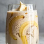 Banana Boat Smoothie in glass on marble surface