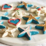 Hand-decorated salt dough shapes on a marble tray